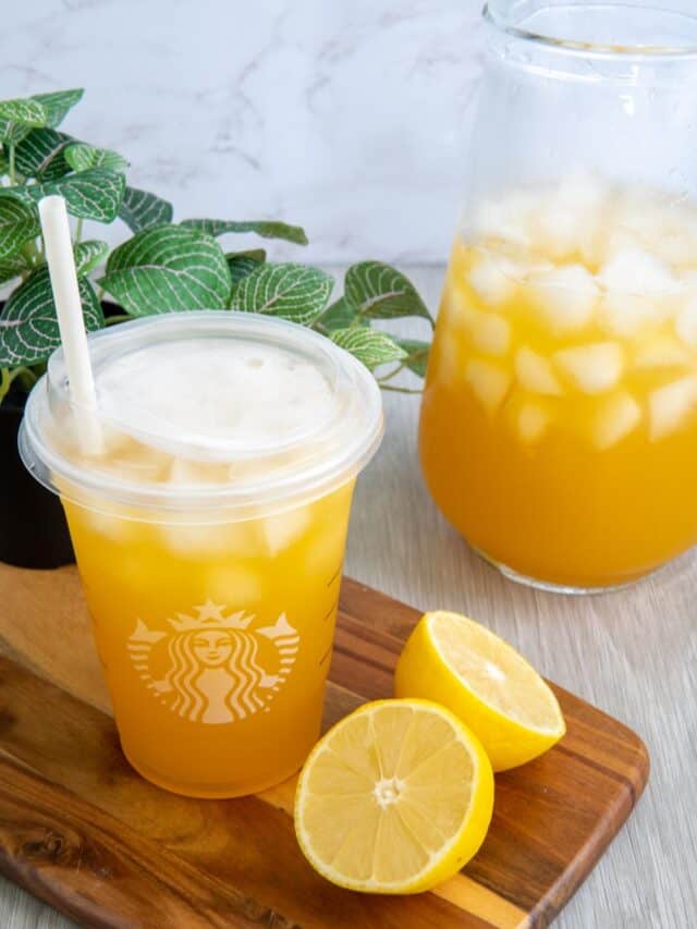 Starbucks peach green tea lemonade recipe in a Starbucks cup with lemons.