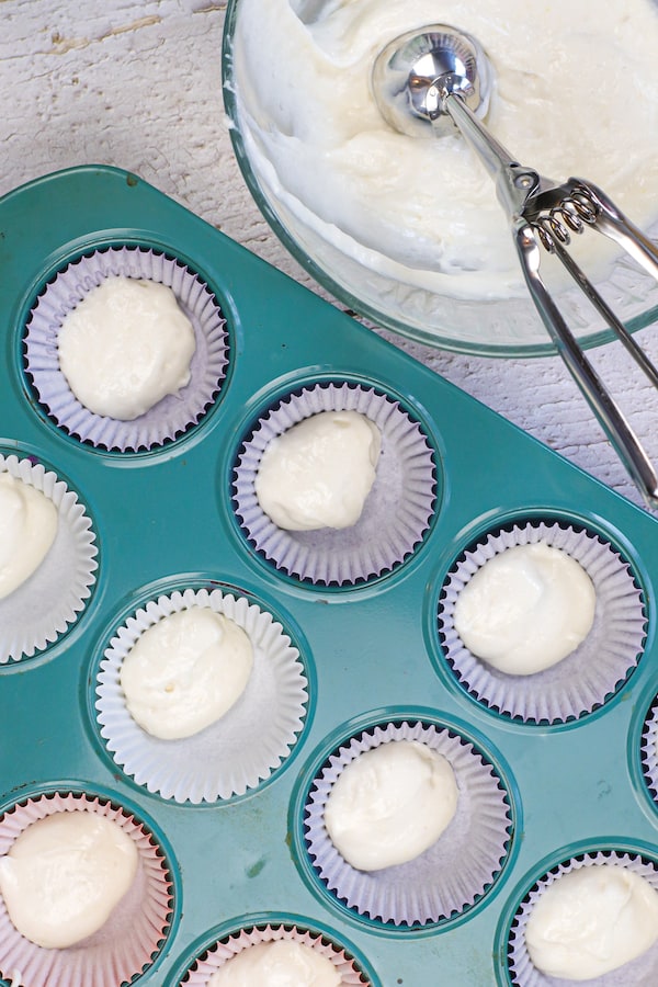 Cupcake liners with plain cupcake batter spooned in.