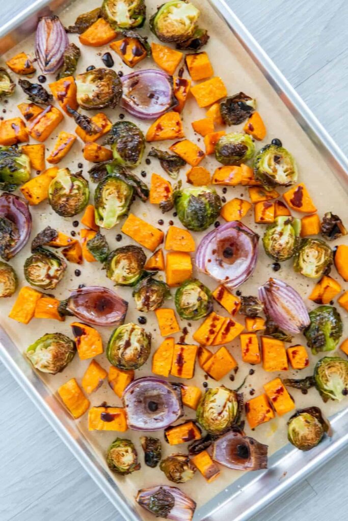 Brussel sprouts, red onions, and sweet potatoes drizzled with balsamic glaze.