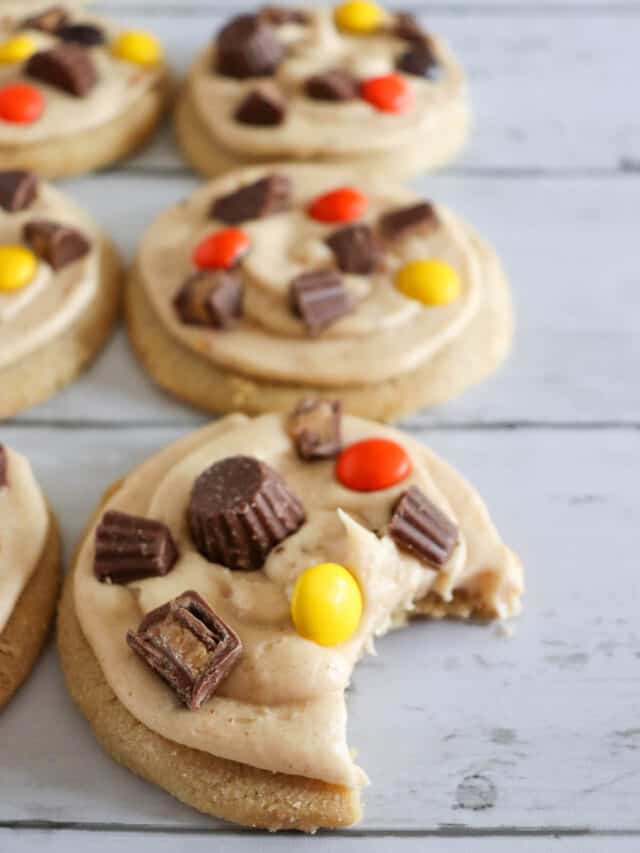 Reeces pieces peanut butter cookies with a bite out of one cookie.
