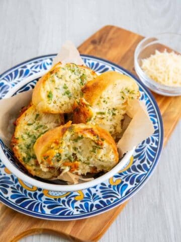 Garlic bread in a bowl made using stuffed garlic bread recipe.