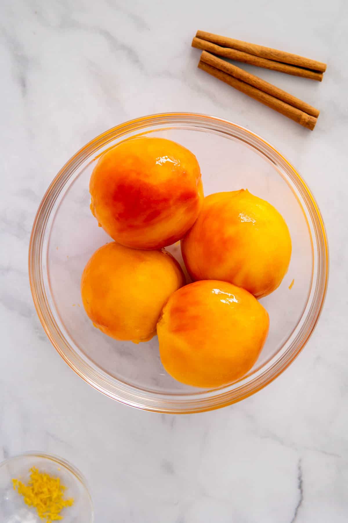 Blanched peaches with the skins removed.
