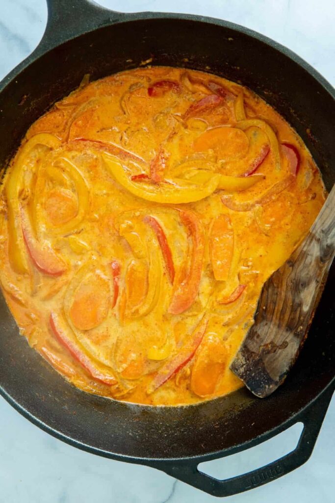 Vegan Thai red curry in a cast iron pan.