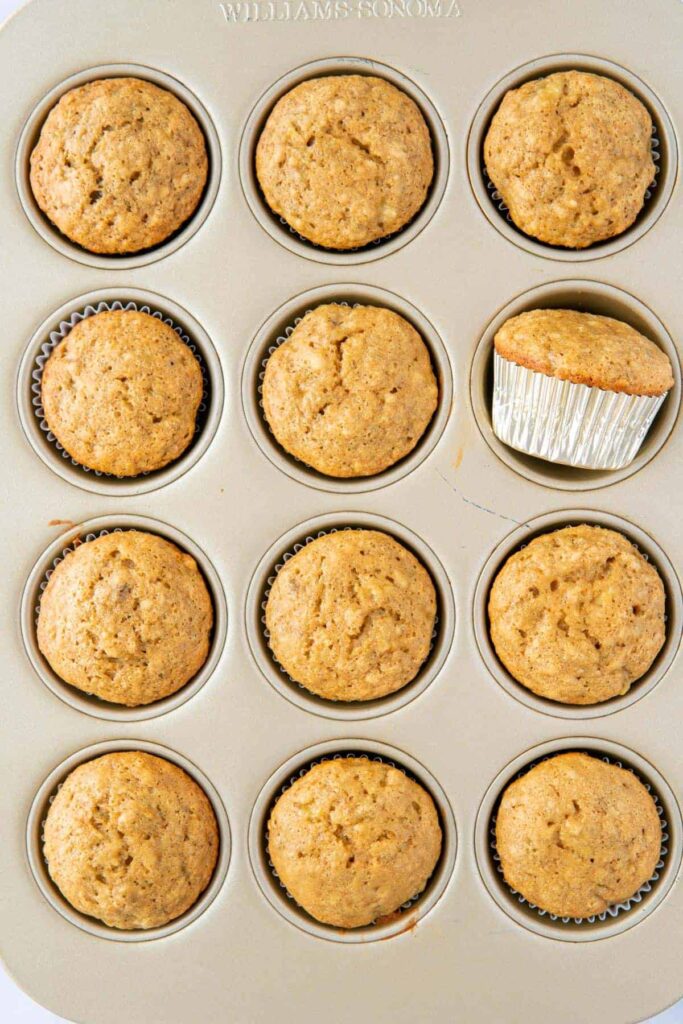Cooked 4 ingredient banana bread muffins in a muffin pan.