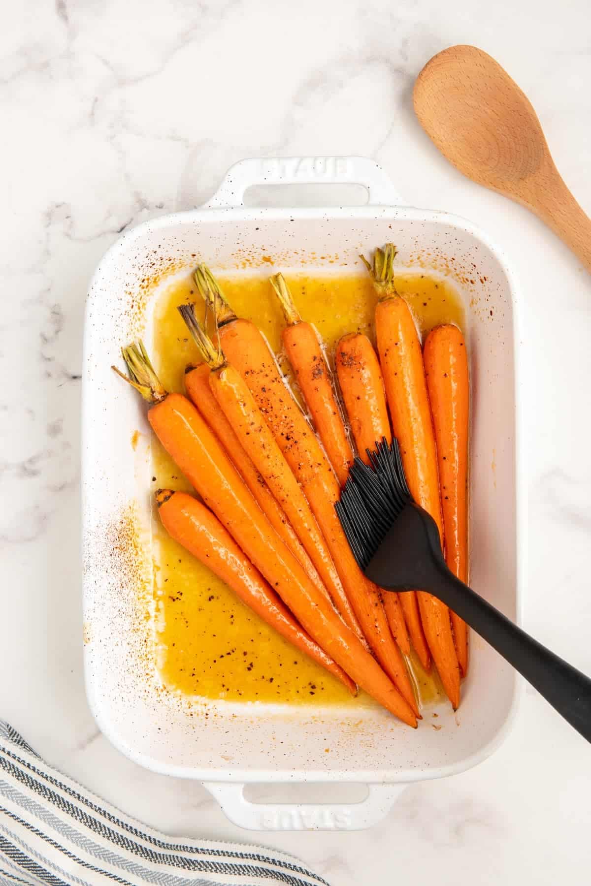 Partially cooked carrots in a brown sugar and honey glaze.