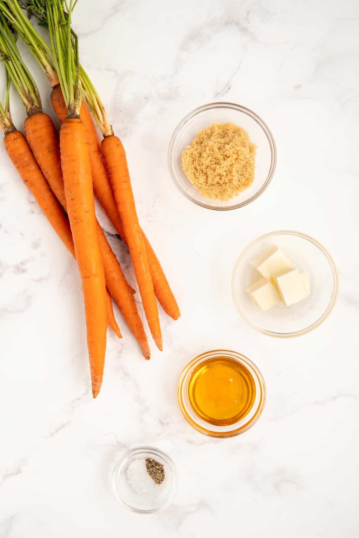 Ingredients needed to make brown sugar honey glazed carrots.