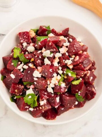 Beetroot and feta salad in a white bowl