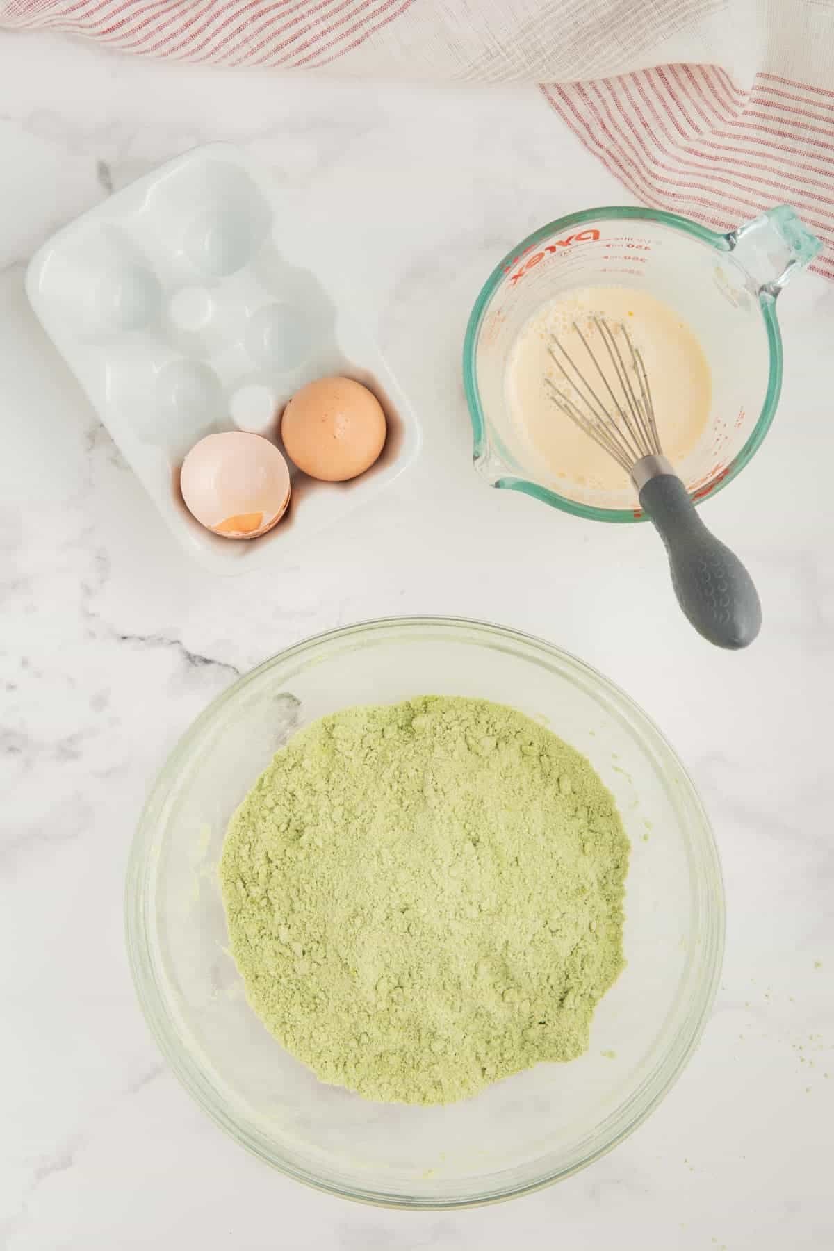 Butter mixed through the dry ingredients for matcha scones.