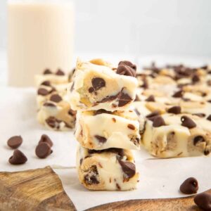A stack of three pieces of cookie dough fudge.