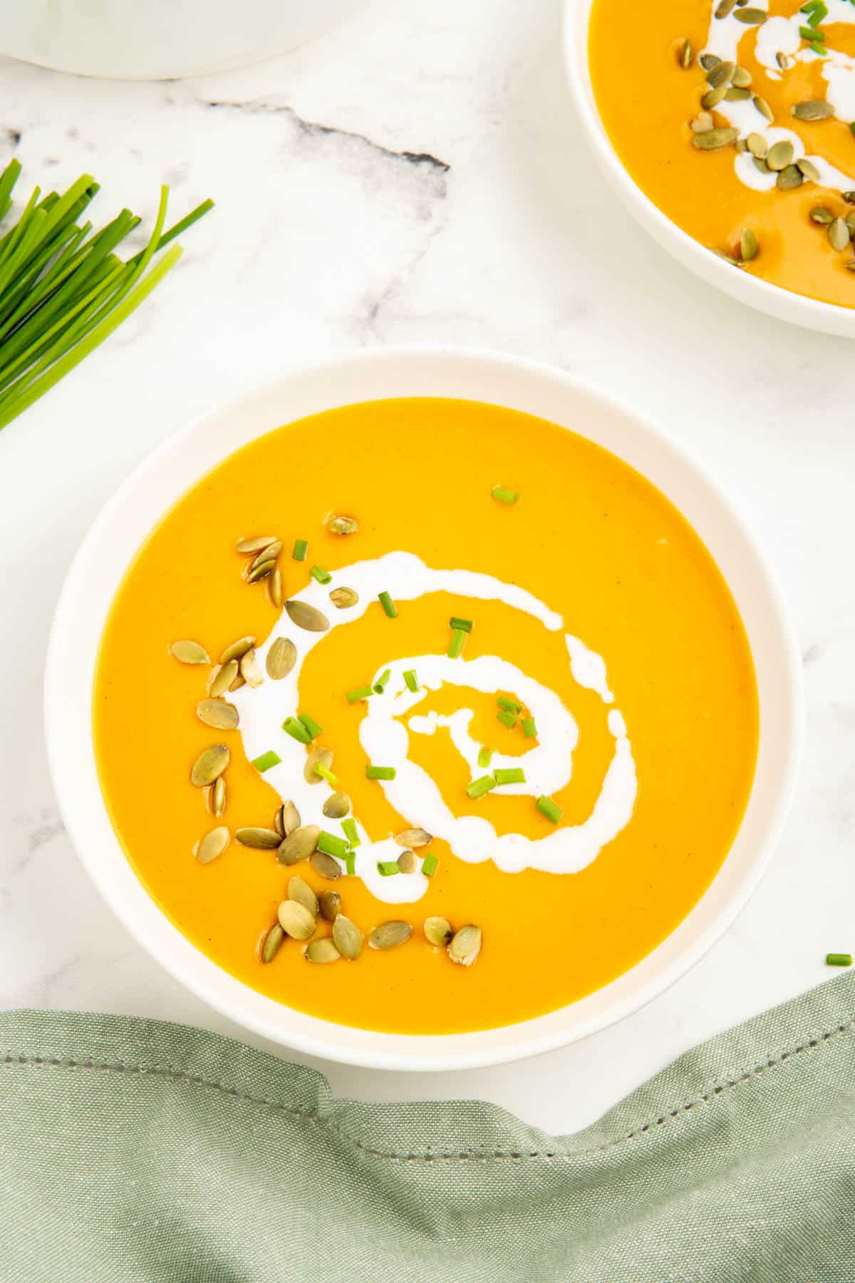 A bowl of pumpkin soup without cream using coconut milk instead.