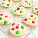 4 Ingredient M&M Christmas cookies on a wire rack.