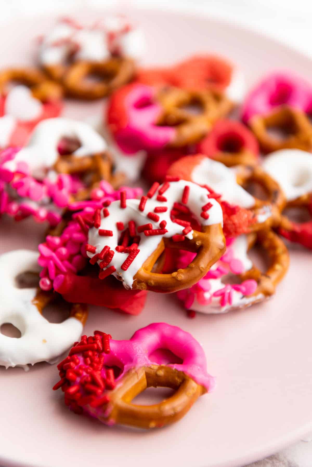 A close up of chocolate coated pretzels for Valentine's Day.