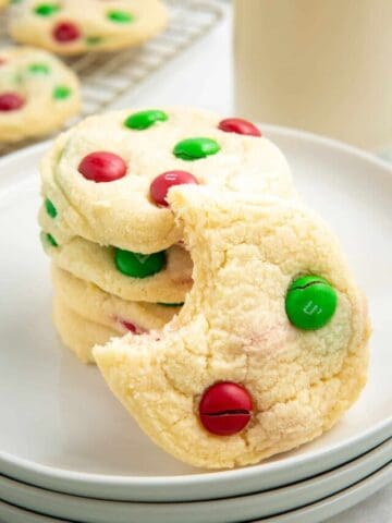 M&M Christmas cookies with a bite taken out of one cookie.