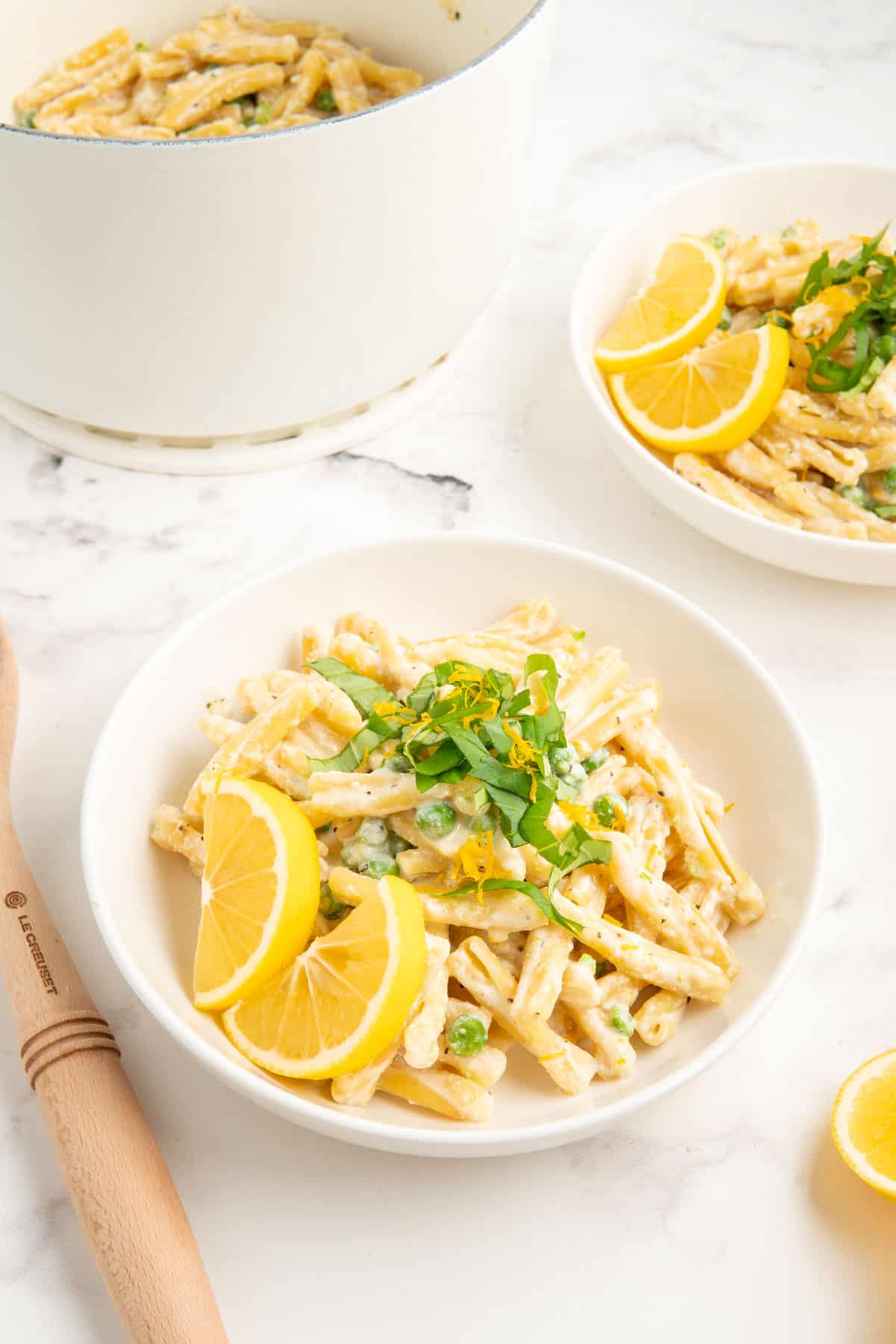 One pot pasta with ricotta and lemon in a white bowl.