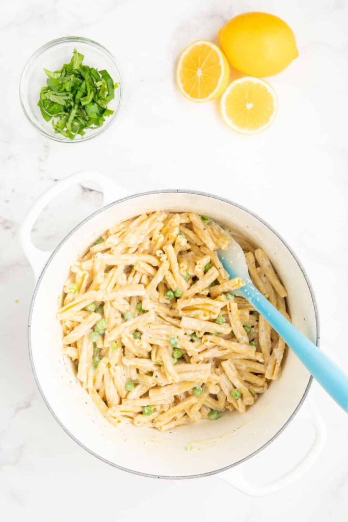 Ricotta and lemon pasta with peas in a Le Creuset pot.