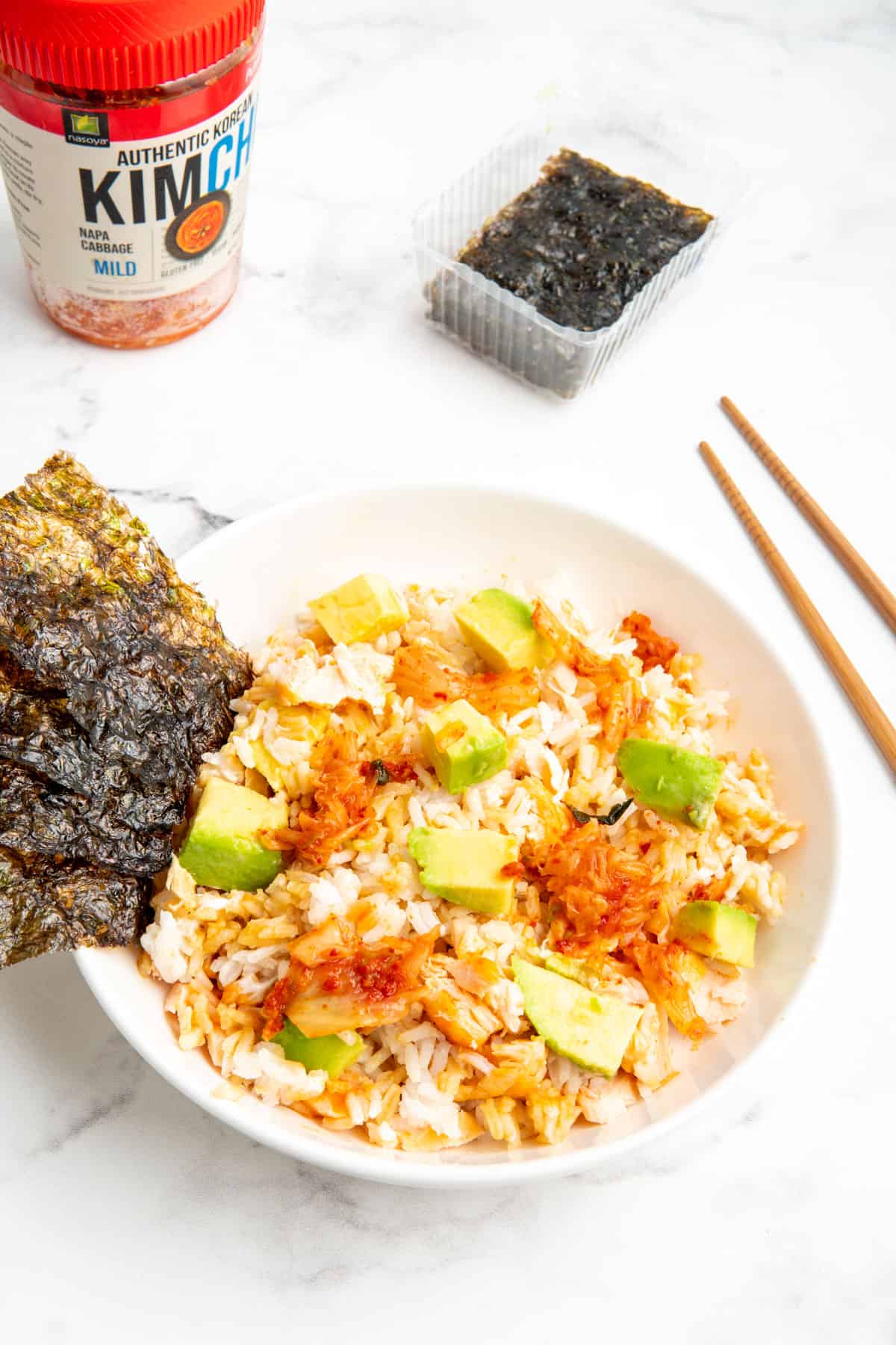 TikTok salmon and rice bowl with topped with avocado and kimchi.