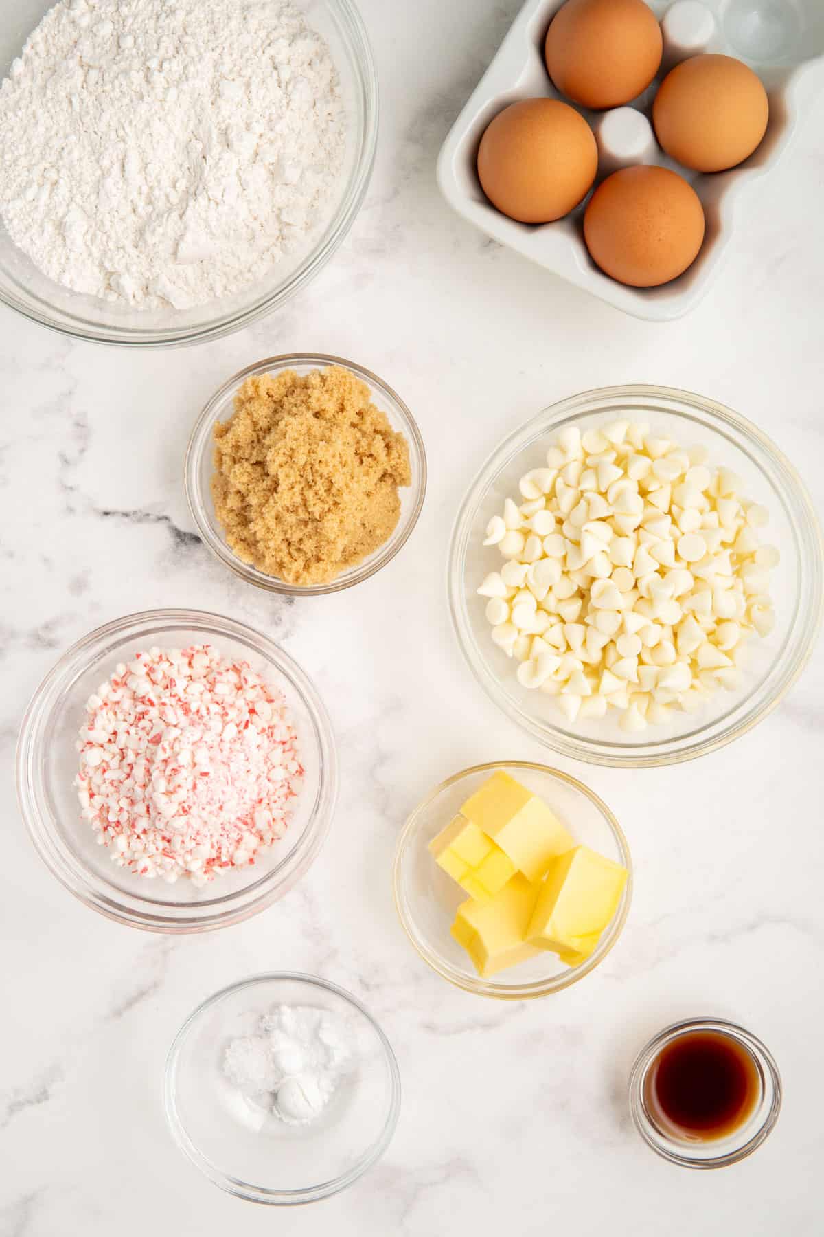 Ingredients needed to make white chocolate peppermint cookies.