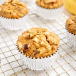 Carrot banana muffins with oats on a wire rack.
