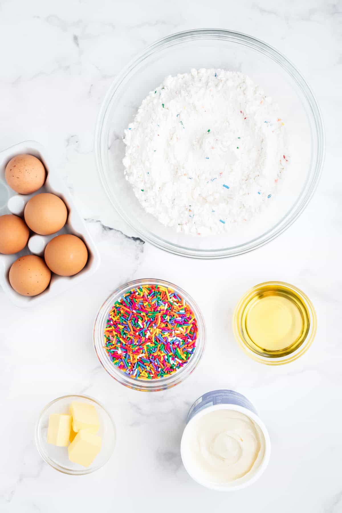 Ingredients needed to make funfetti cake mix cookies.