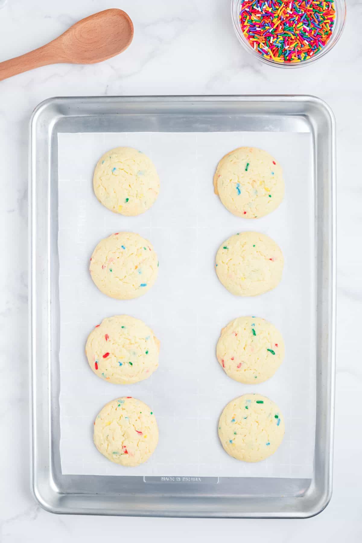 Funfetti cake mix cookies on a baking tray.