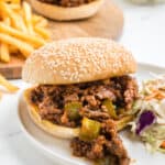 An old fashioned sloppy joe sandwich with french fries and coleslaw.