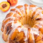 Peach cobbler pound cake with cream cheese and a vanilla glaze.