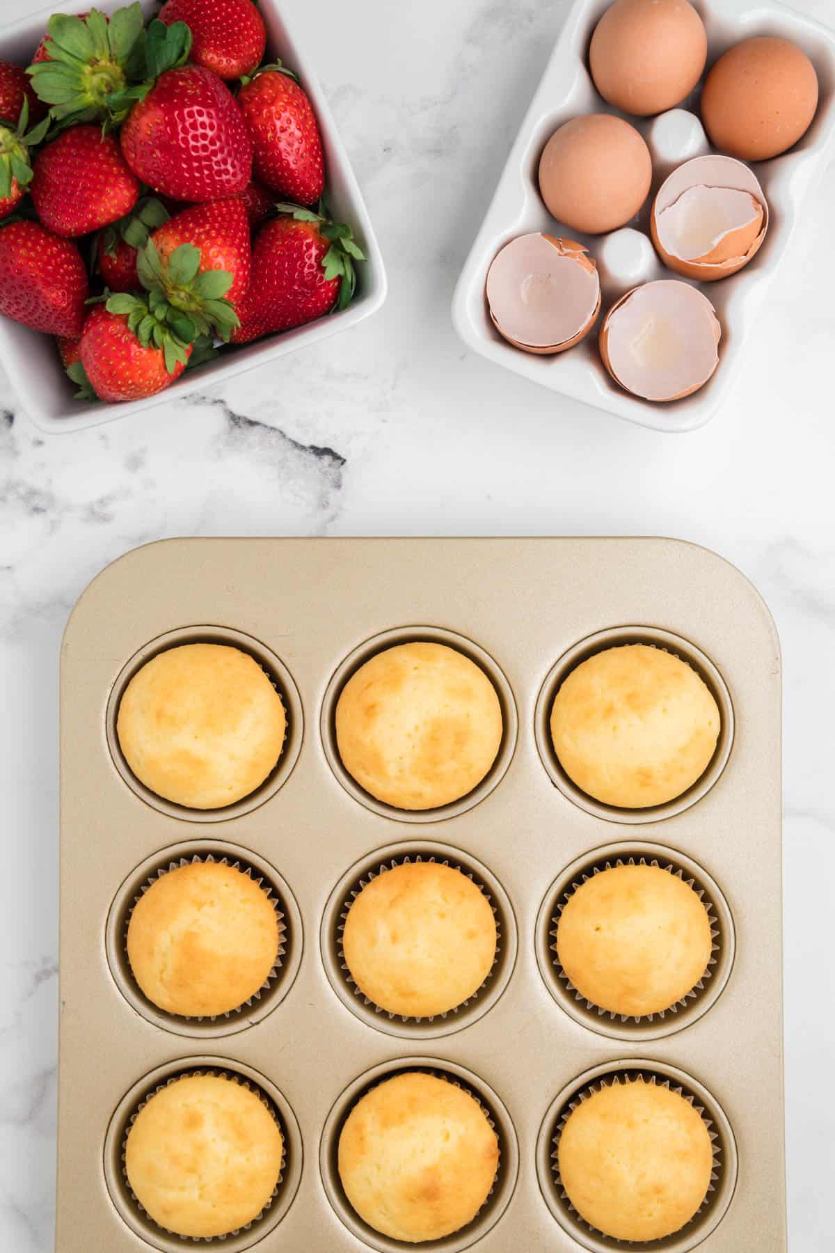 Cupcakes made from white cake mix baked in a muffin tin.