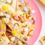 Easter bark with Cadbury mini eggs served on a pink plate.