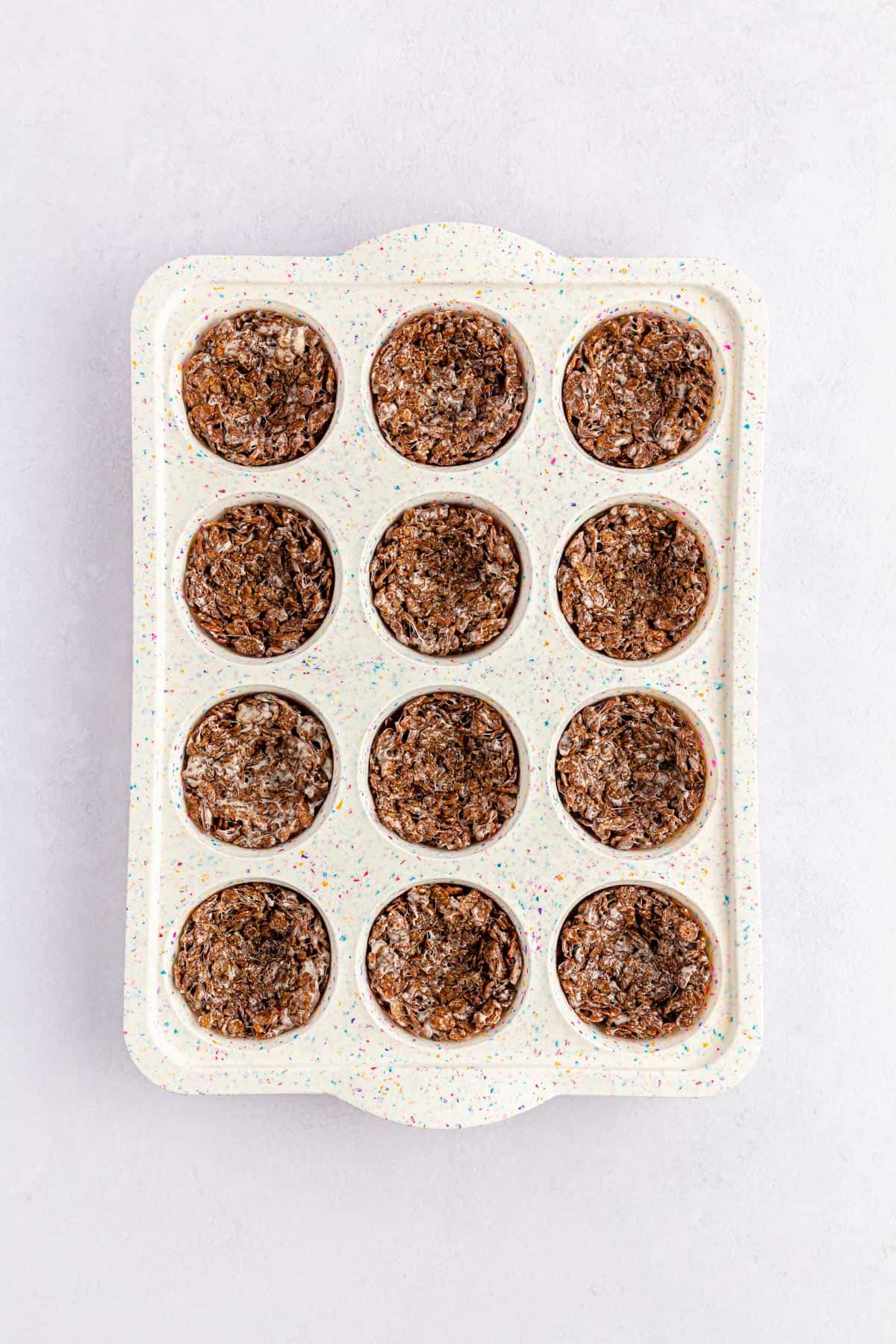 Chocolate Easter nests formed in a muffin pan.