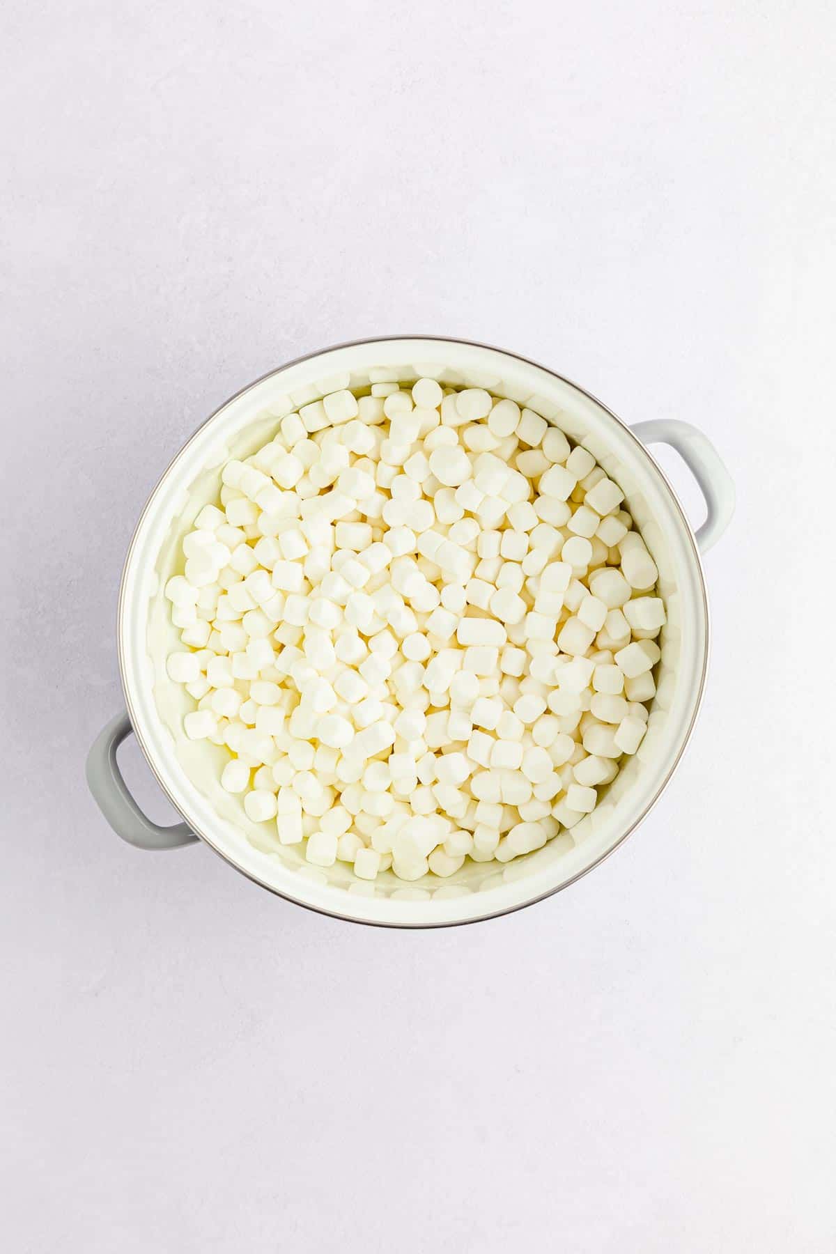 Marshmallows in a white pot for lucky charms treats.
