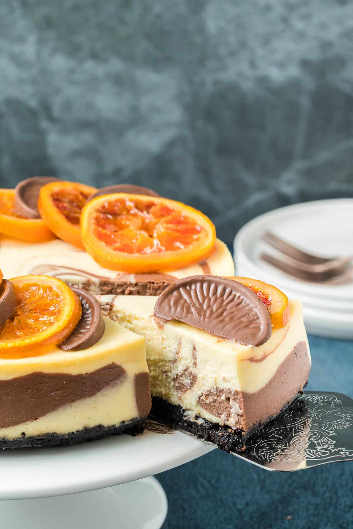 A slice of chocolate orange cheesecake showing the marble interior.