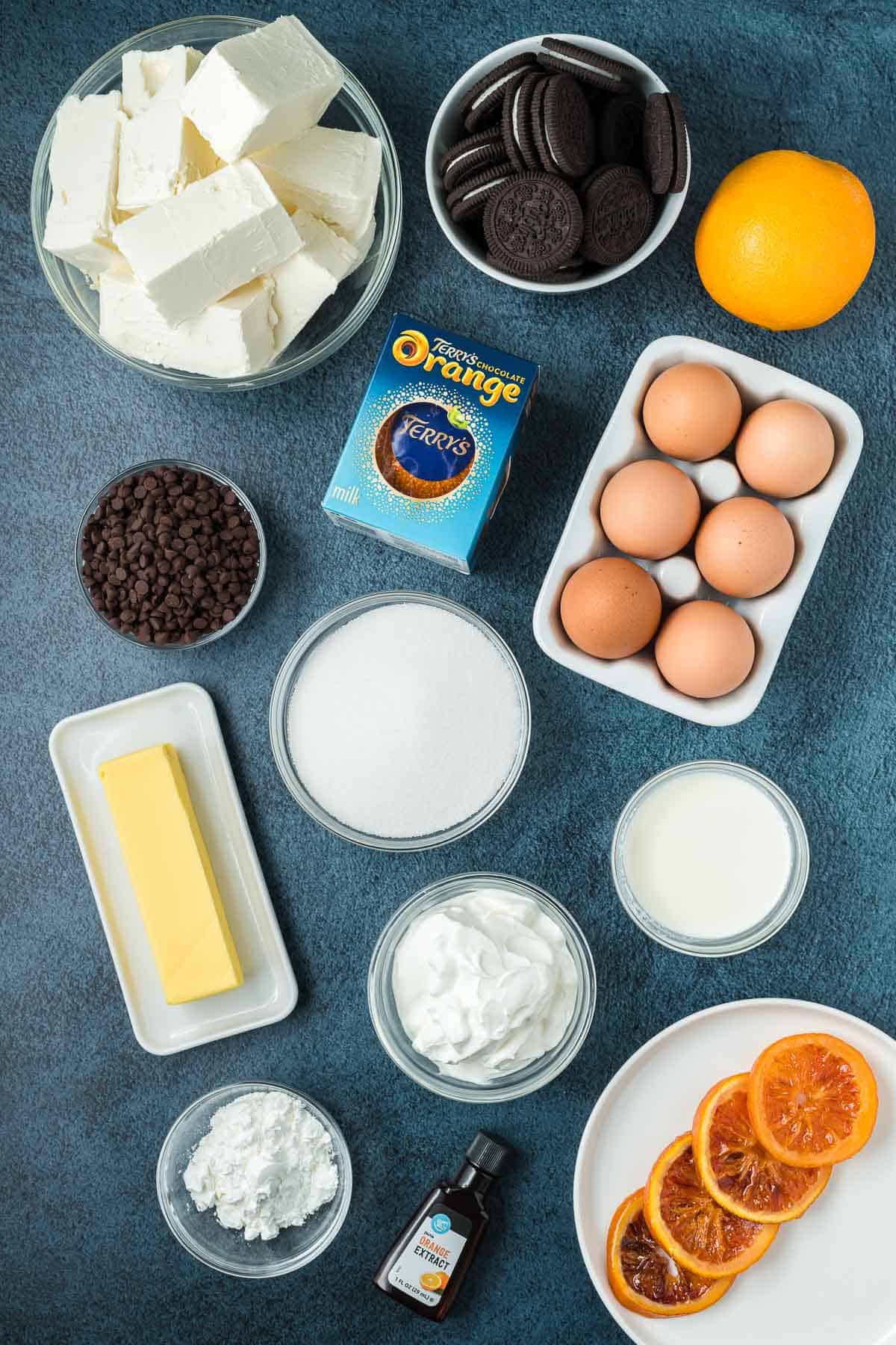Ingredients needed to make marble chocolate orange cheesecake.