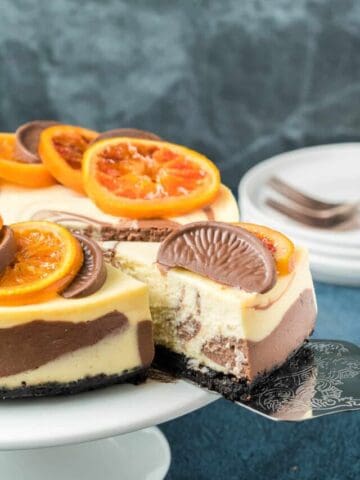 A slice of chocolate orange cheesecake showing the marble interior.