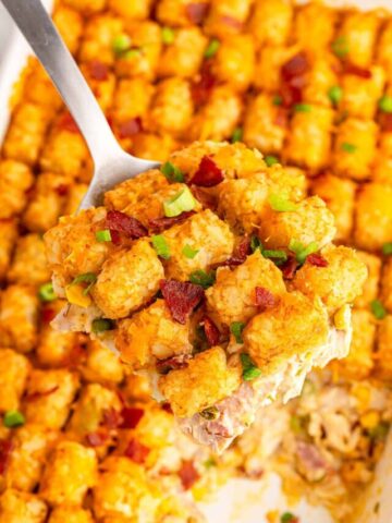 A scoop of easy cheese chicken tater tot casserole.